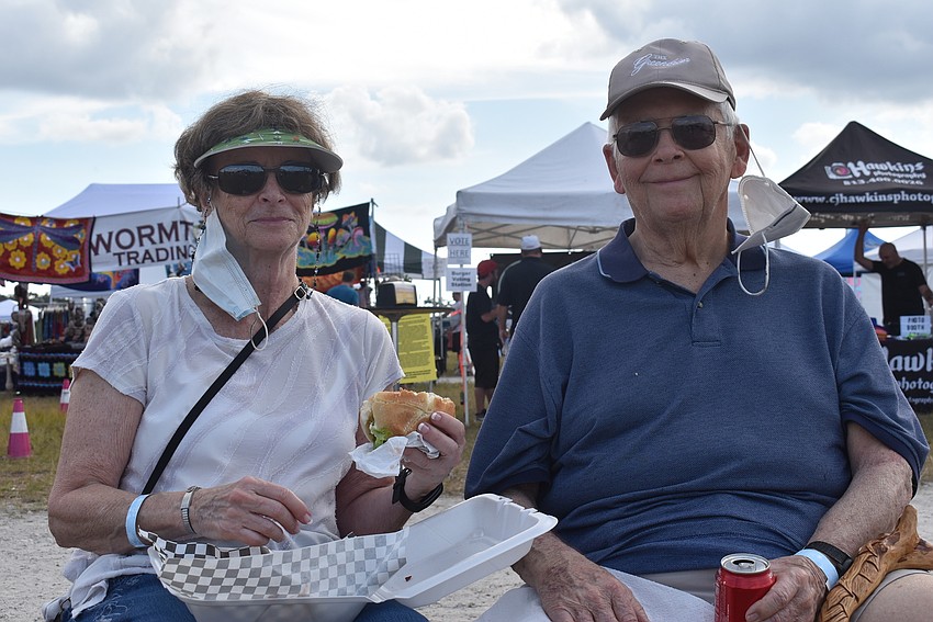 West Virginia residents Leslie Weddle and David Weddle are vacationing in the area to get away from snow. They got a burger from Renegade Burger Company that came with 