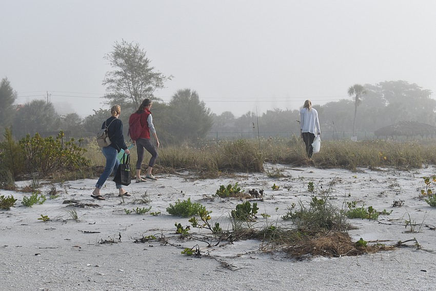 Carlyn Vigil, Cyndi Seamon and Barbara Benz stuck close to the vegetation line.