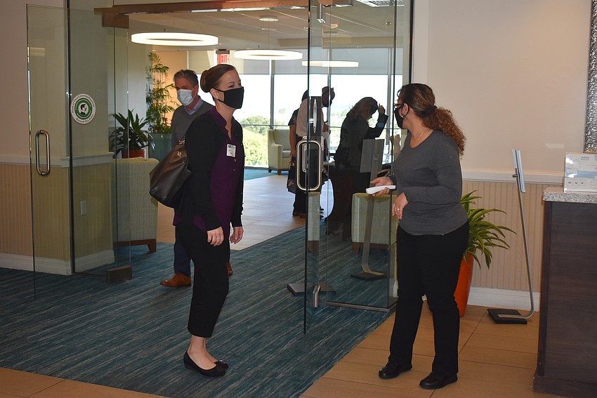 Attendees had their temperature checked as they came into the Holiday Inn Lido Beach.