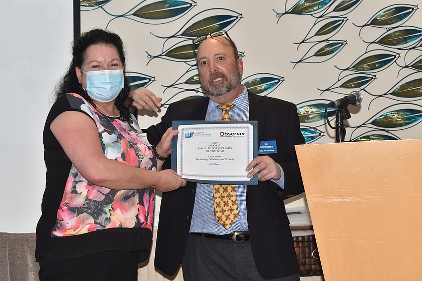 Celia Moore, third in Rookie Business Person of the Year, with Al Benincasa.