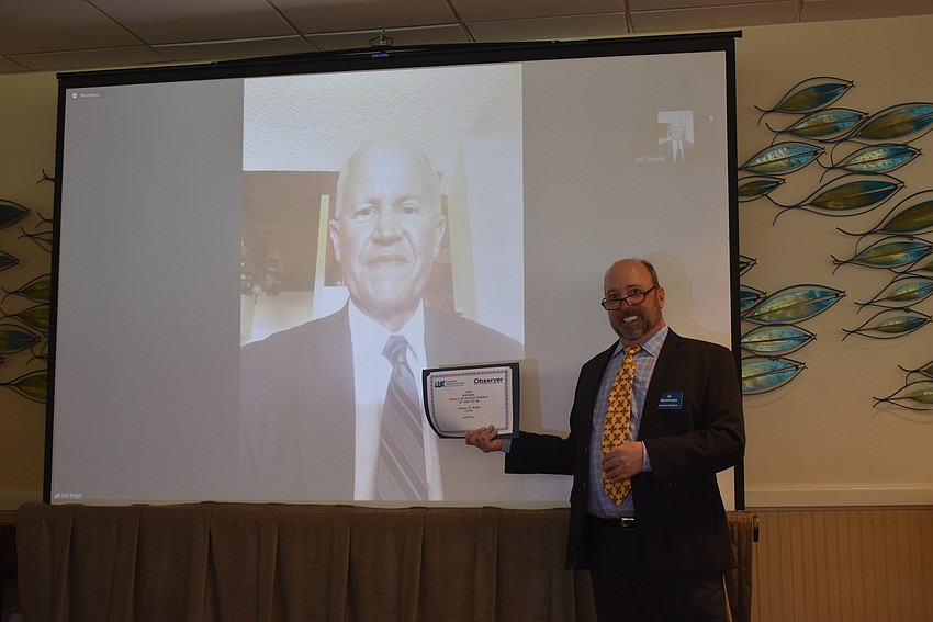 Tom Bright, second in Rookie Business Person of the Year, Zoomed in and poses with Al Benincasa.