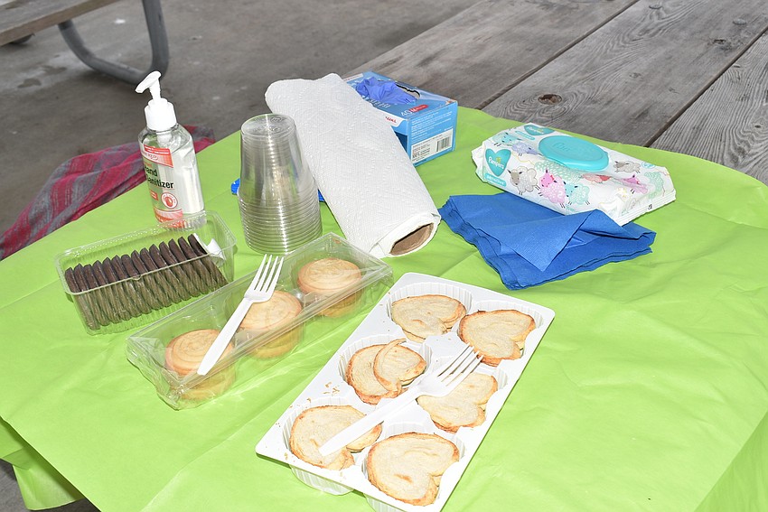 Gloria Feibus brought dessert for anyone who wanted it, and plenty of hand sanitizer.