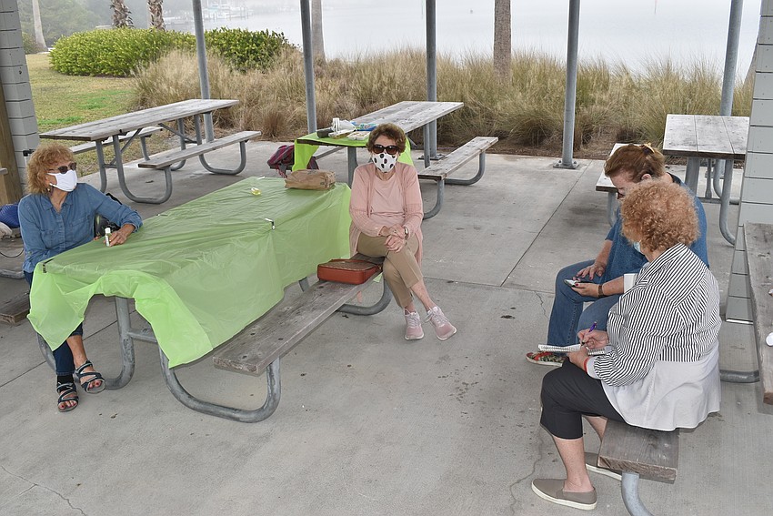 Lois Barson turned to speak with Sharon Schreiber and Suzanne Schuster.