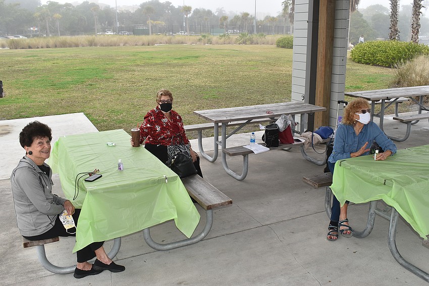 Barbara Pressman, Elise Galinsky and Lois Barson keep chat flowing between their two tables.