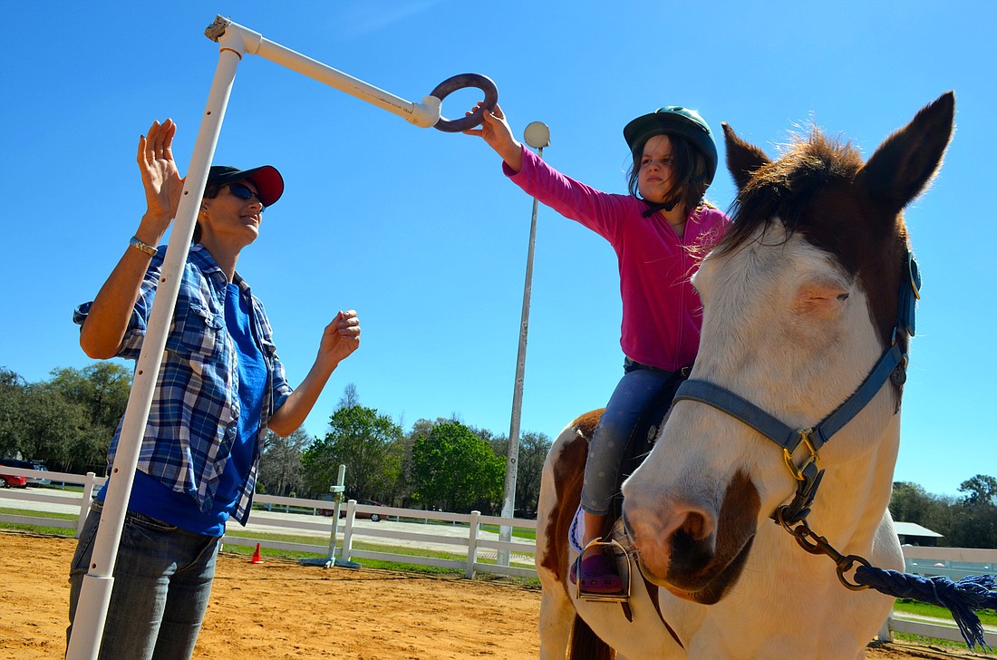 Clients work through various mounted activities to boost their cognitive functions. File photo