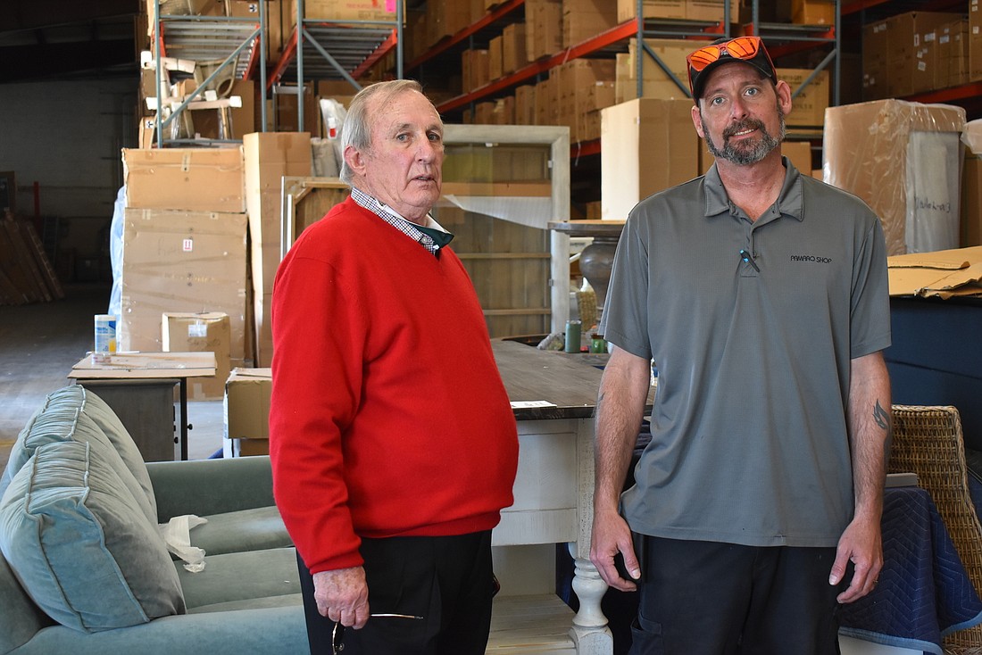 Warehouse worker David Wright and Pamaro Shop Furniture owner Ray Osborn stand in the company&#39;s current warehouse in Sarasota. Osborn is moving the warehouse to Lakewood Ranch to be closer to the area&#39;s population growth.