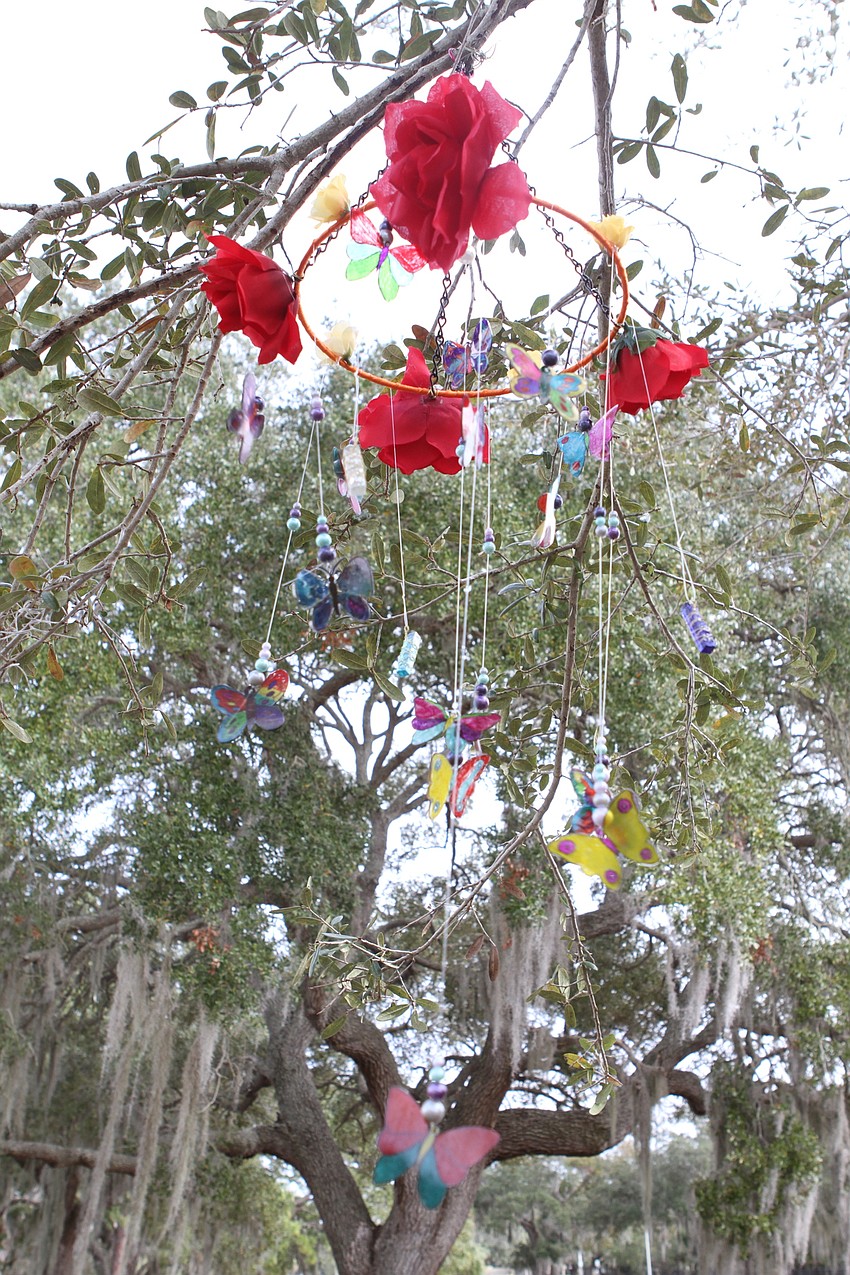 The garden has butterfly mobiles hanging overhead.