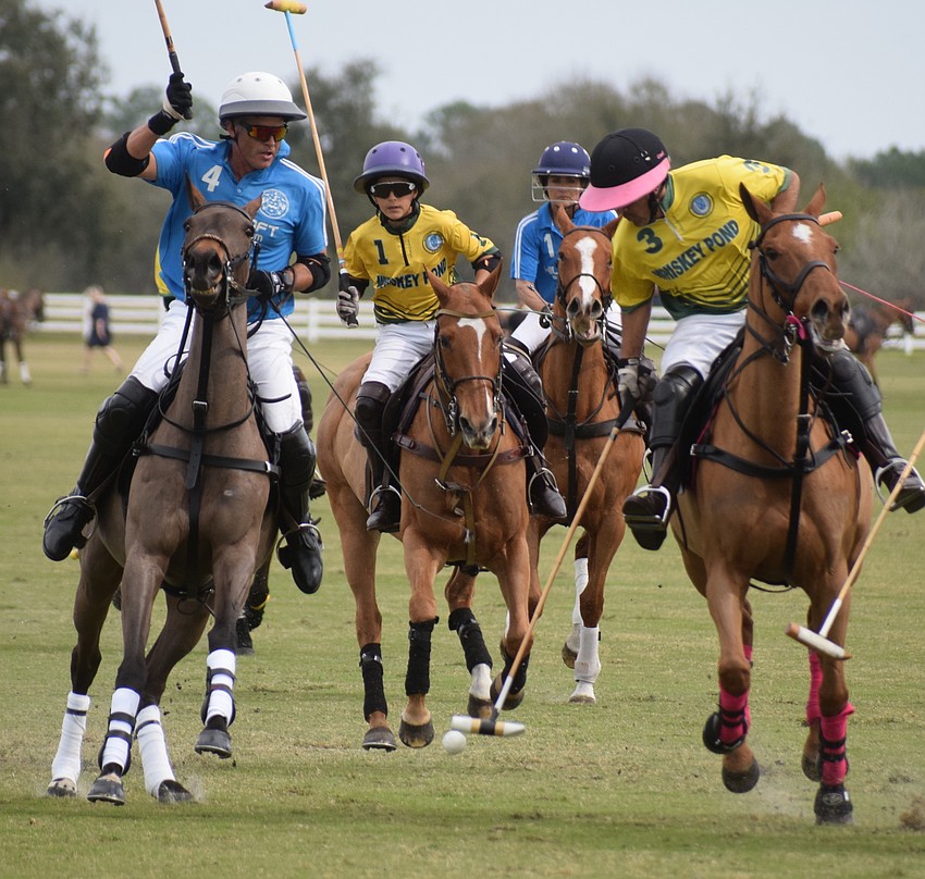 James Miller of Hillcroft and Ramon Collardin and Toto Collardin of Whiskey Pond race for the ball during the Jan. 31 match.