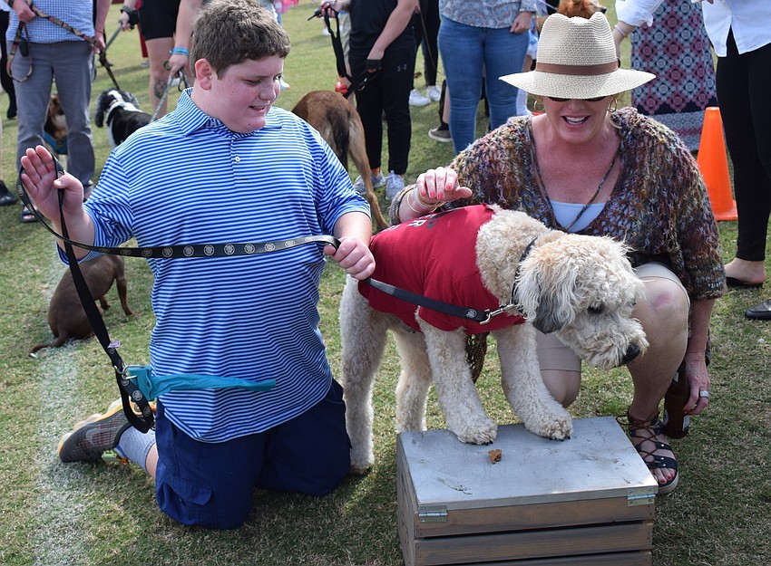Maximus Miele and Kim Miele show off Oscar during the Woofminster dog show.