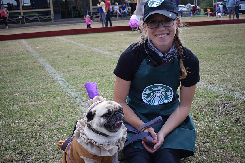 Passie the Pug and Paige Lautzenheiser came as Pugachino and a barista.