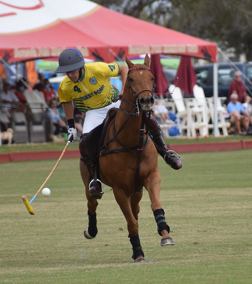 Whiskey Pond's Toto Collardin tries to get control of the ball while going full speed.