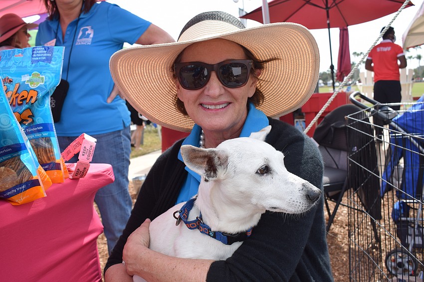 Susan Giroux, the vice president of the Humane Society at Lakewood Ranch, shows off Pudding, a 5-year-old Jack Russell who is up for adoption.