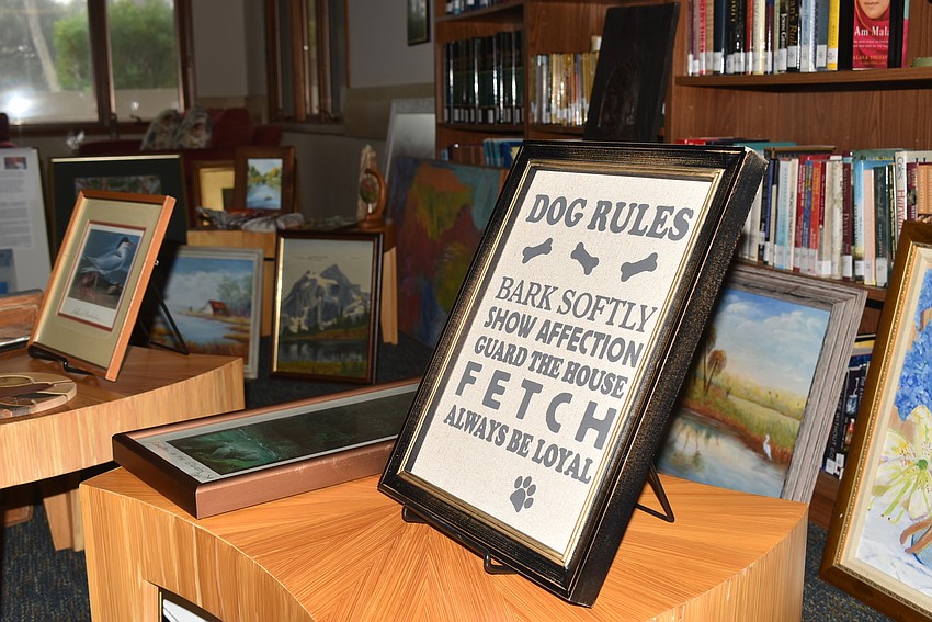 The art rested in the library before it was hung in the gallery.