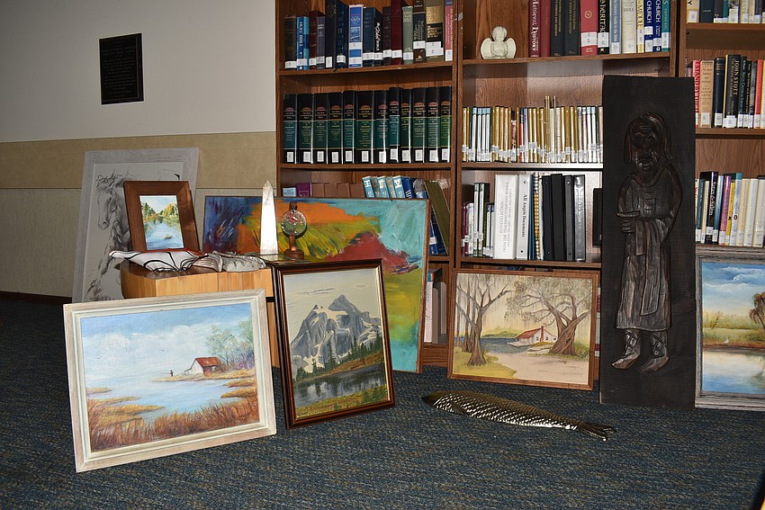 The art rested in the library before it was hung in the gallery.