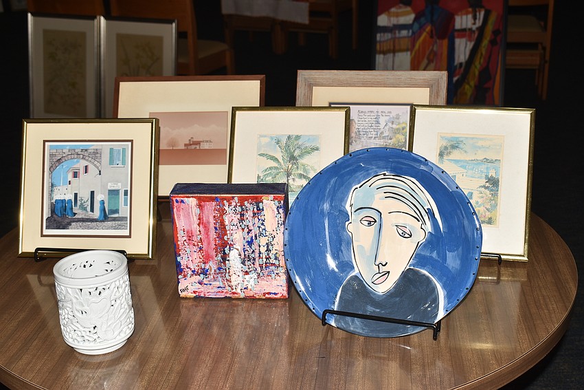 Torres and Marshall set up a table of art that they wouldn't hang on the walls.