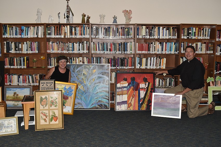 Linn Torres and Dave Marshall amongst the artwork.