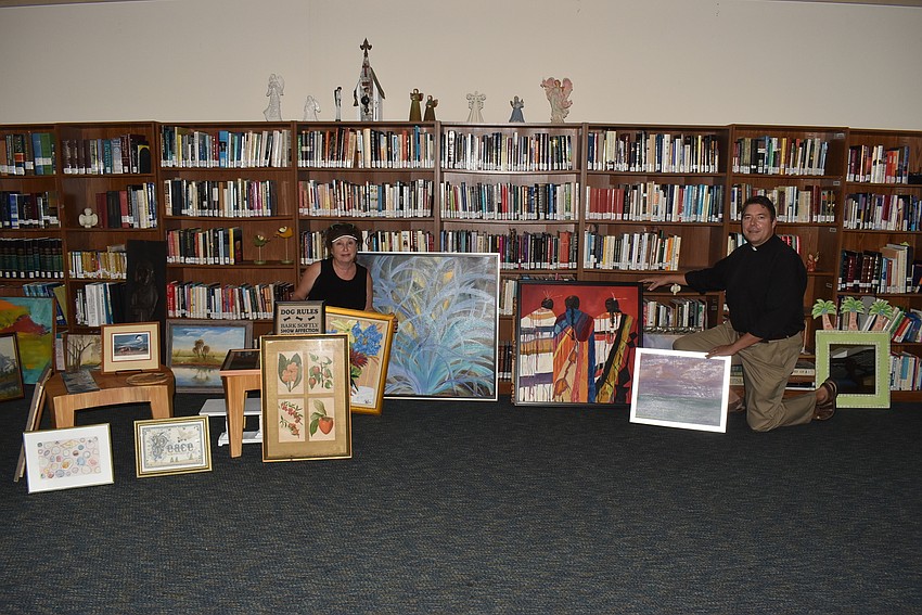 Linn Torres and Dave Marshall amongst the artwork.