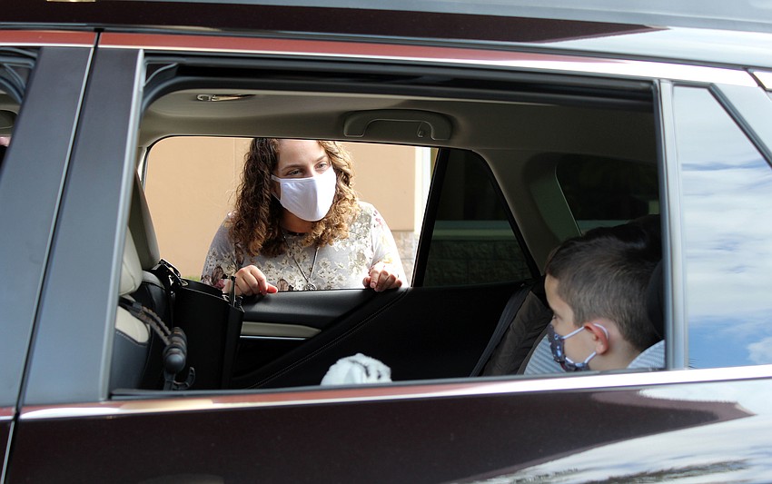Rabbi Samantha Kahn performs blessings with Adam Fischberg-Feliciano.