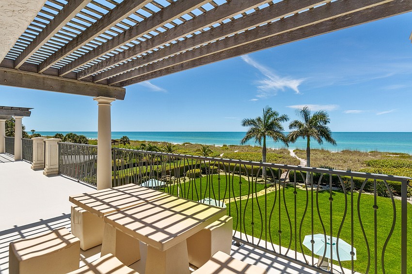 The beachfront land is tropically landscaped.