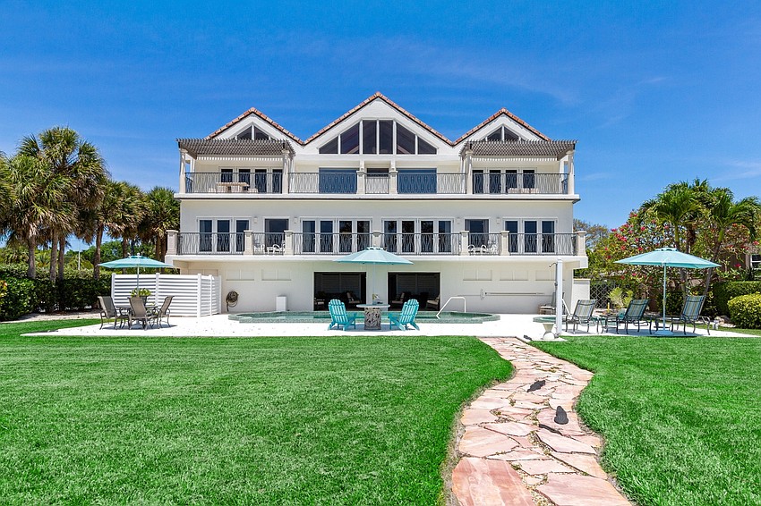 The beachfront land is tropically landscaped.