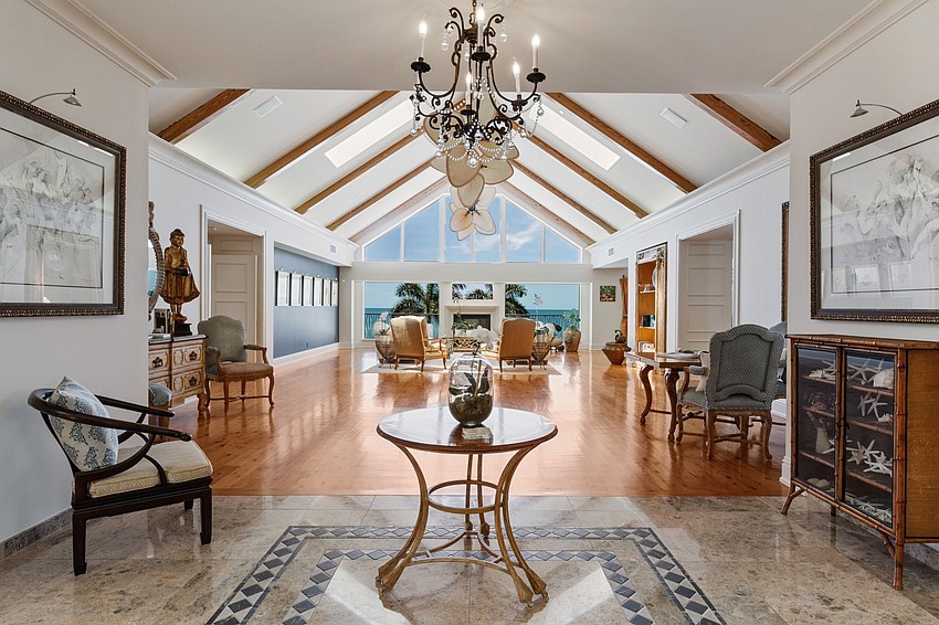 The home's large windows overlook the beach.
