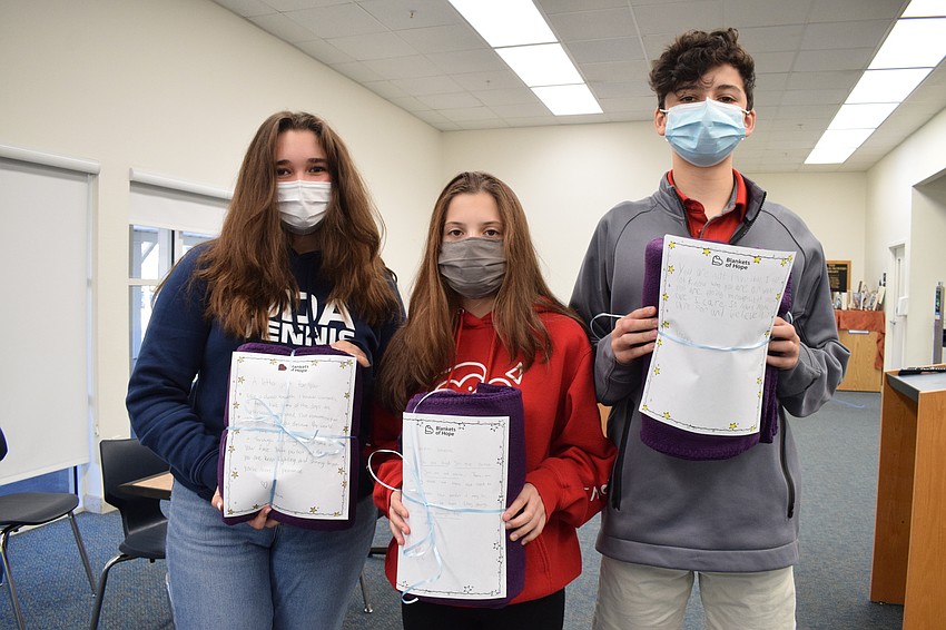 Freshmen Gavin Gargano, Alexa Rouen and Joseph Clarke show off their letters and blankets. ODA students in pre-K through 12th grade participated in the Blankets of Hope project.
