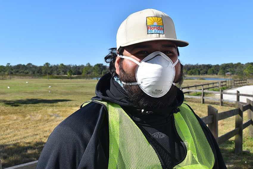 Sergio Velasquez works for the Florida Department of Health in Manatee County. Although he typically works in HIV prevention work the county's vaccine site at Tom Bennett Park.