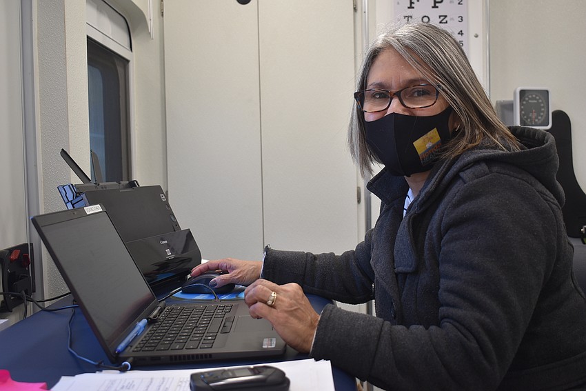Iris Gonzalez is a human services specialist with the Florida Department of Health in Manatee County. She files vaccine-related data and paperwork and acts as a Spanish translator when needed.