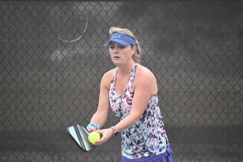Lakewood Ranch resident Dana Townson prepares to serve the ball. She has been playing pickleball for about six months. Townson and west Bradenton resident Daria Zoller won their first match 15-8.