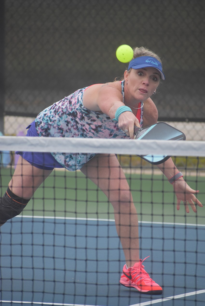 Lakewood Ranch resident Dana Townson attempts to return the ball. She has been playing pickleball for about six months. Townson and west Bradenton resident Daria Zoller won their first match 15-8.