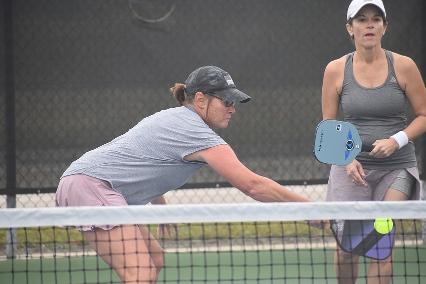 River Strand resident Mary Becker and Lakewood Ranch resident Donna Messersmith have been playing pickleball for about three years. They lost their first match 15-8.