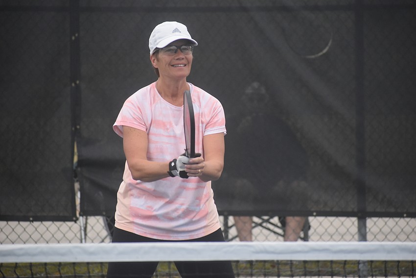 River Strand resident Deb Clawson has been playing pickleball for three years. She and fellow River Strand resident Cindy Cail lost their first match 15-14.