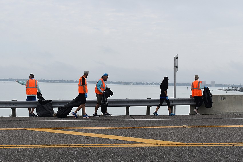 Members cross back over the bridge.