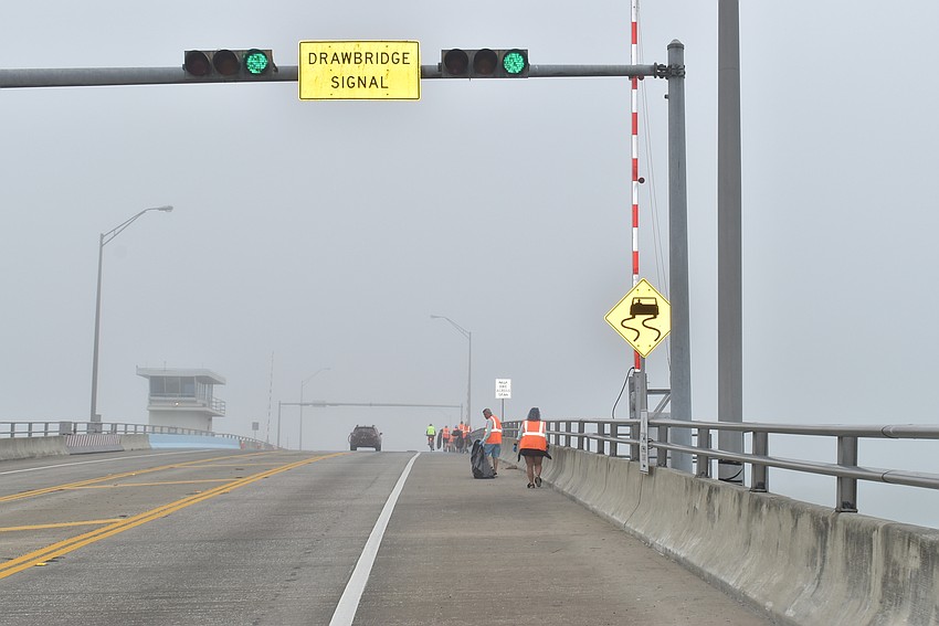 Members head over New Pass Bridge.