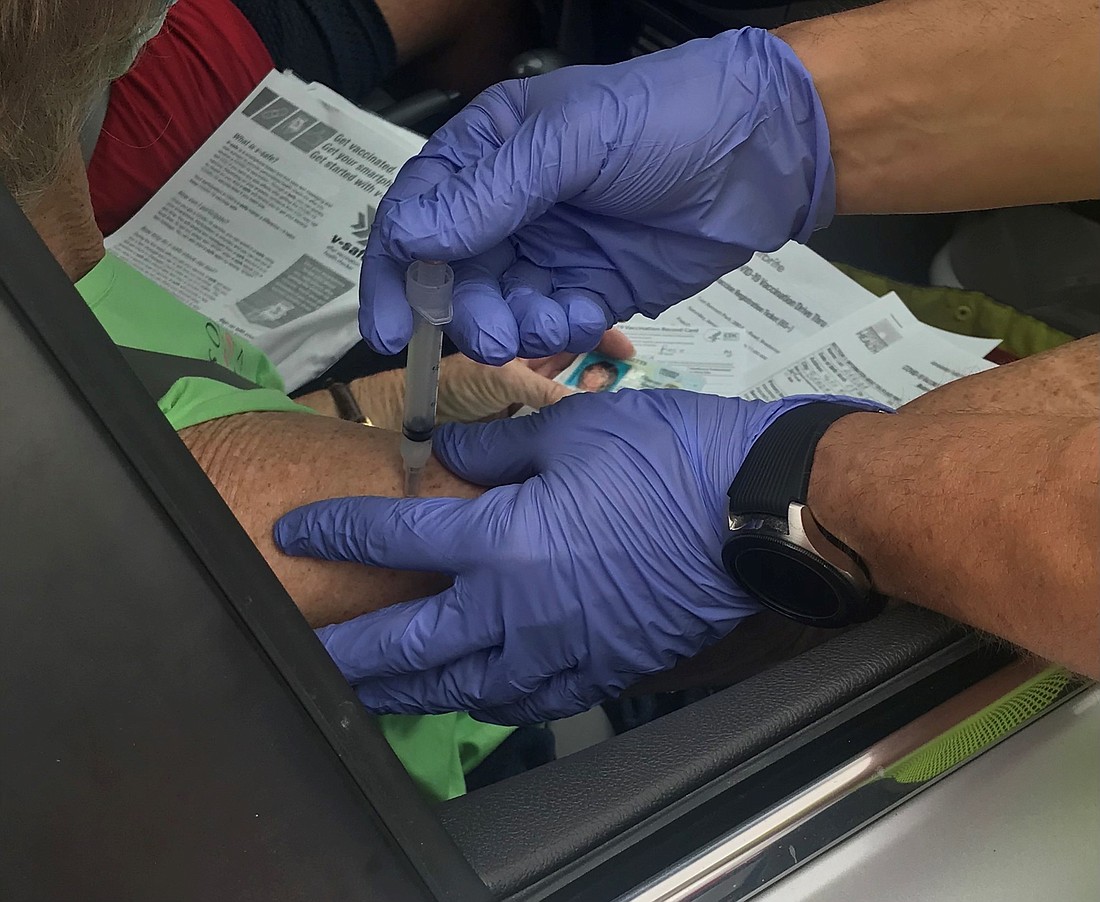 A COVID-19 vaccination is given in the drive-thru vaccination operation at Tom Bennett Park. (Courtesy of Florida Department of Health-Manatee County)