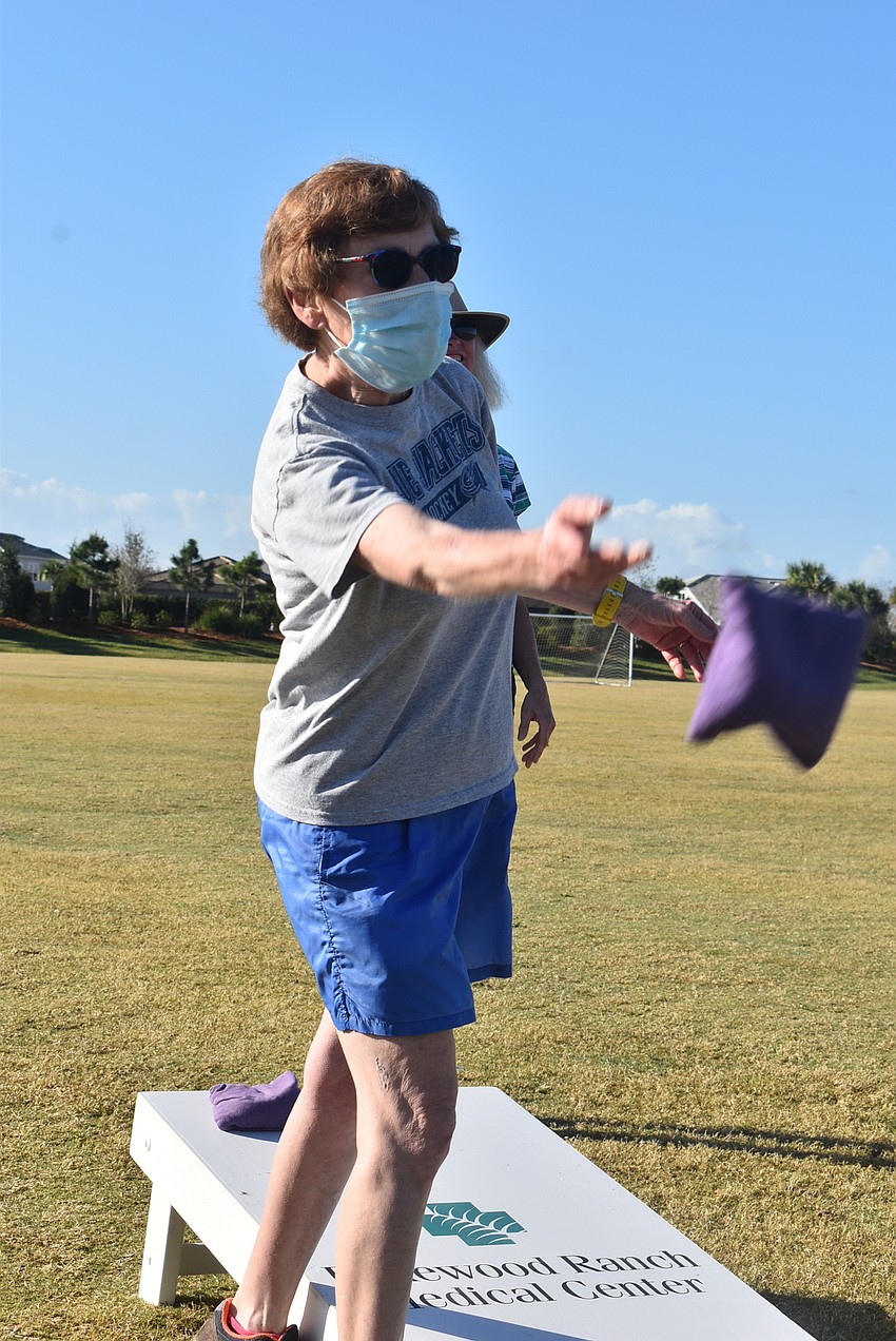 Country Club East resident Nancy Menard played cornhole for the very first time Feb. 11. She said it was the first time she tried a sport she was good at, with the possible exception of bowling.