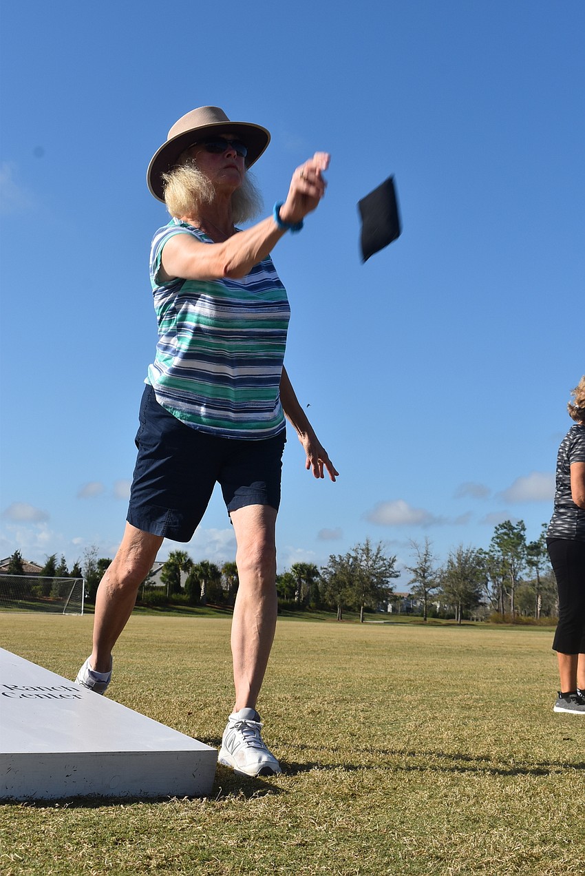 Country Club East resident Sheri Holmes said her neighbor, Nancy Menard, asked her if she wanted to play cornhole while their husbands played golf.