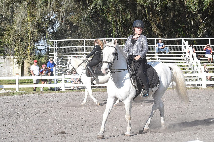 Samantha Dittman (back) and Sydney McCullough have their horses mirror each other during a routine.