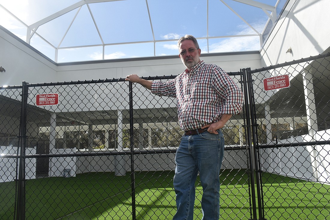 Bishop Animal Shelter Exceutive Director Keith Pratt stands in the exercise area of the shelter&#39;s newest facility, a 25,000-square foot animal rescue center and isolation facility with capacity for 68 dogs and 250 cats.