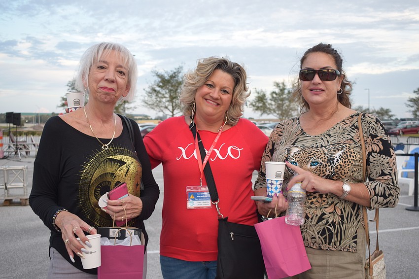 Sarasota's Cheryl Lycans and Melody Miller enjoy drinks and food samples with Venice's Diane Lancelotta before the movie begins.