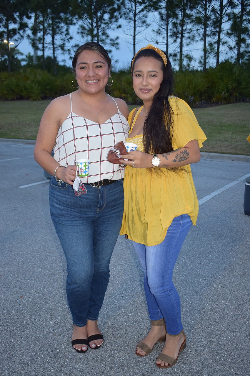 Sarasota's Anahi Muñoz and Paola Fletes, of west Bradenton, enjoy samples from Loaded Cannon Distillery. 