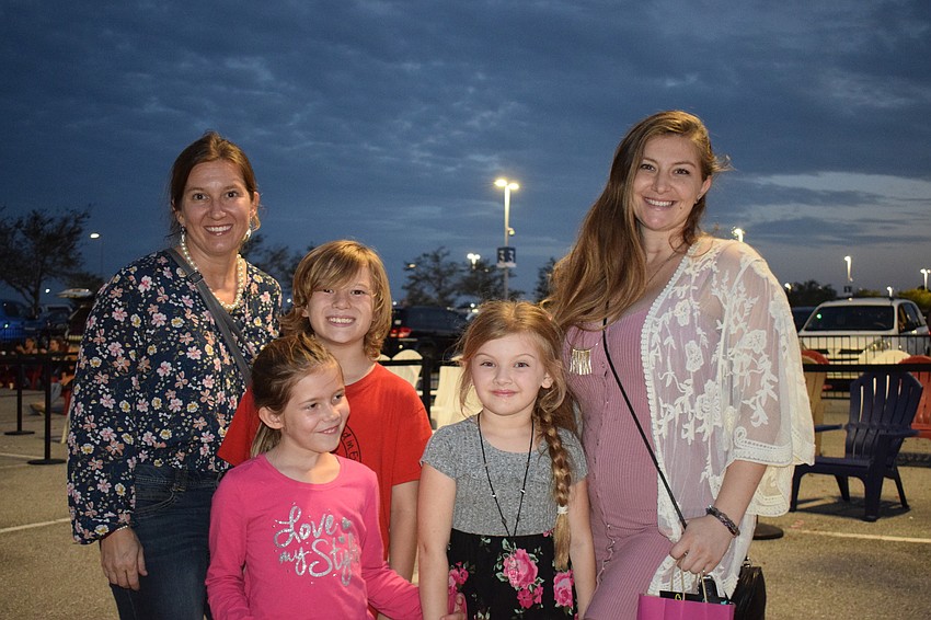 Sarasota's Anna Turner has a fun night with her 9-year-old son Dymitrek Turner and 6-year-old daughter Mikayla Turner as well as Sarasota's Megan Babeu and her 6-year-old daughter, Madelyn Mills.