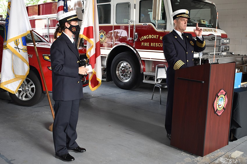 Fire Chief Paul Dezzi (right) named Fire Rescue liaison and public information officer Tina Adams (left) as the 2020 employee of the year.
