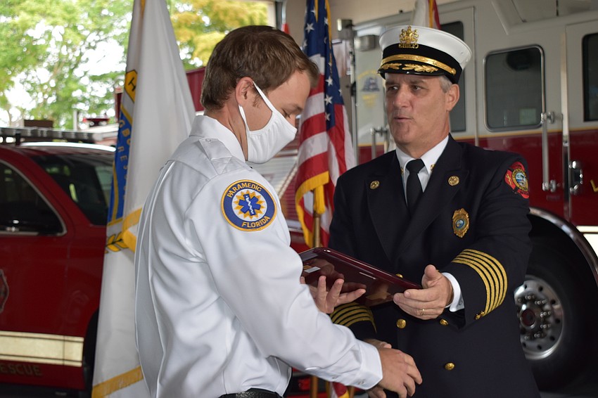 Firefighter and paramedic David Oliger (left) won the Fire Chief Award. Fire Chief Paul Dezzi (right) is pictured with Oliger.