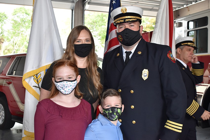 Newly-promoted Assistant Chief Bryan Carr is pictured with his wife Tori, his son Anderson and his daughter Olivia.