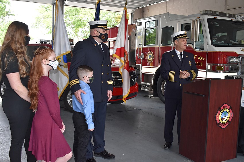 Newly-promoted Assistant Fire Chief Bryan Carr is joined by his family during Tuesday morning's ceremony.