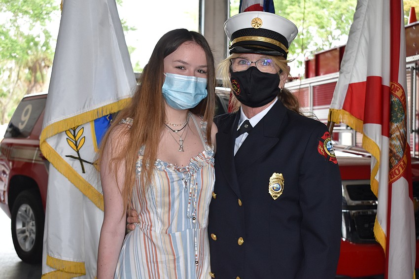 Newly-promoted Assistant Chief Jane Herrin poses for a photo with a family member.