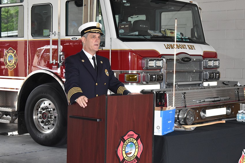 Longboat Key Fire Chief Paul Dezzi speaks during Tuesday morning's ceremony.