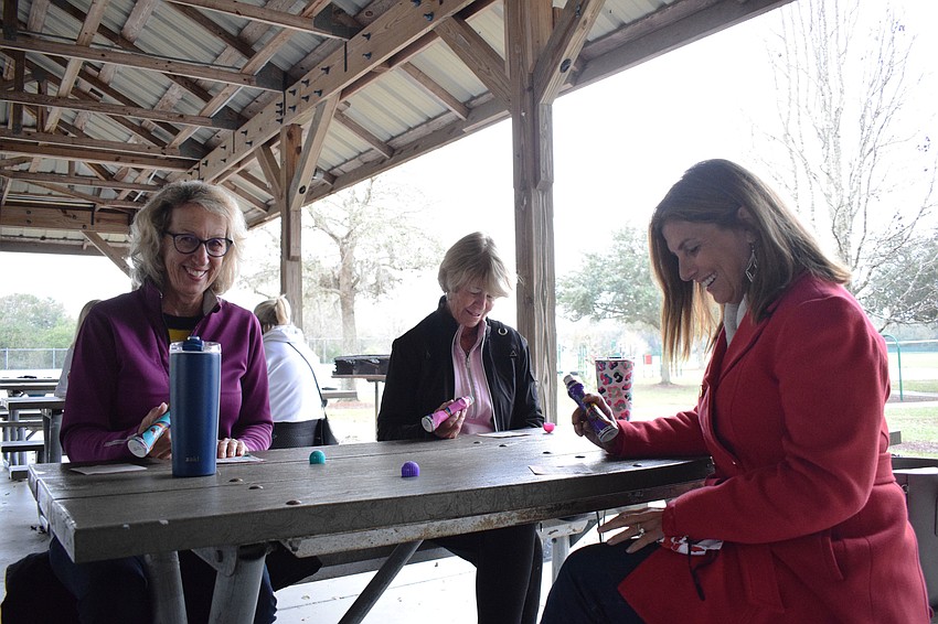 Greenbrook's Deb Robertson, Country Club East's Sue Brown and Waterside's Amy Hullinger joke around while playing bingo. 