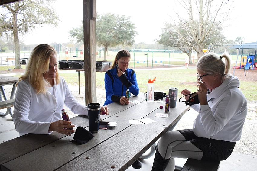 Eagle Trace's Tina Clements, Lakewood Ranch's Kim Iannuccillo and Greyhawk Landing's Cara Laney enjoy spending the morning playing bingo. It was their second time going to Community Bingo.